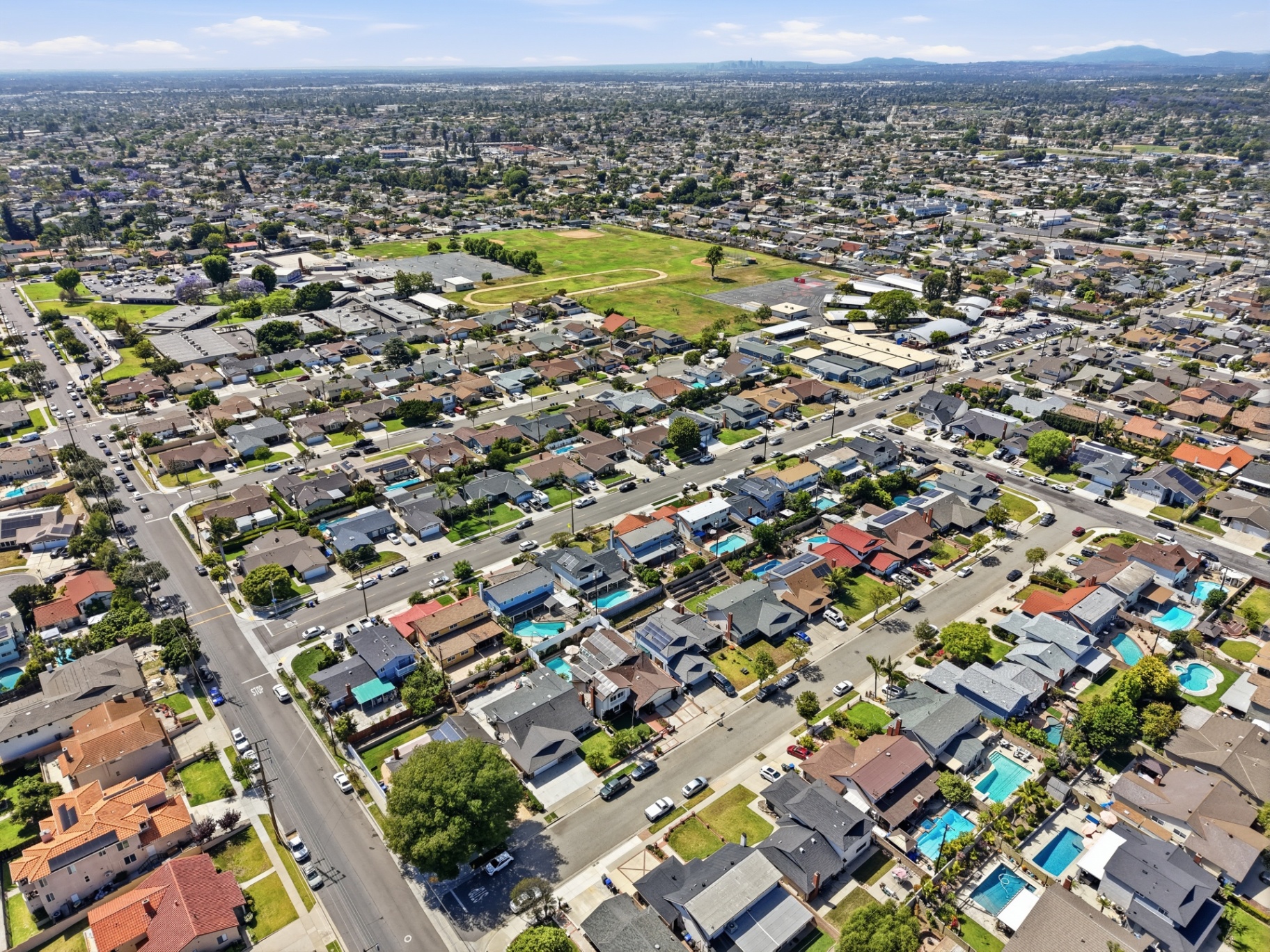 Aerial drone view of a residential neighborhood and local park
